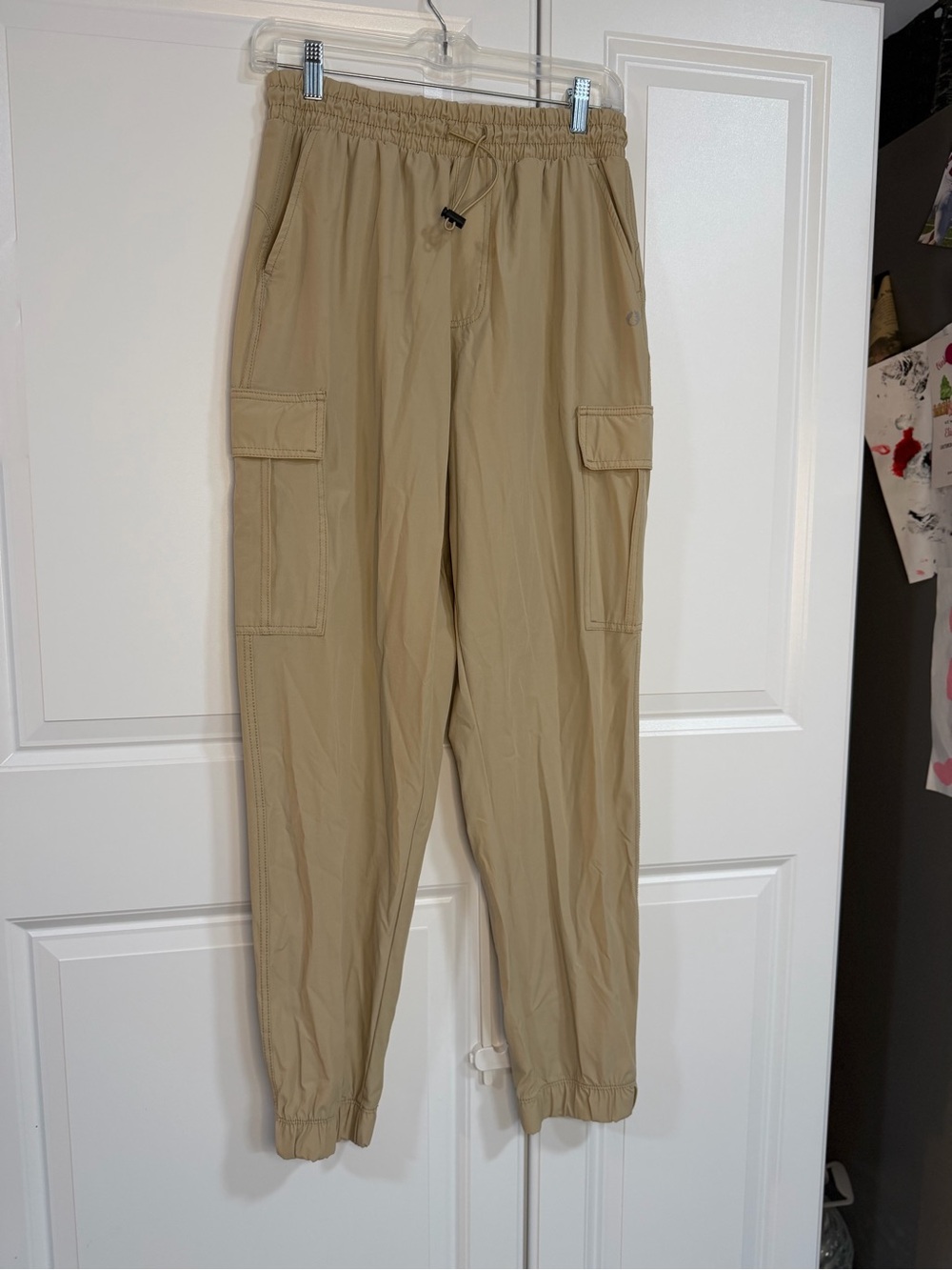 The American Outdoorsman Women's Performance Joggers in a tan/khaki